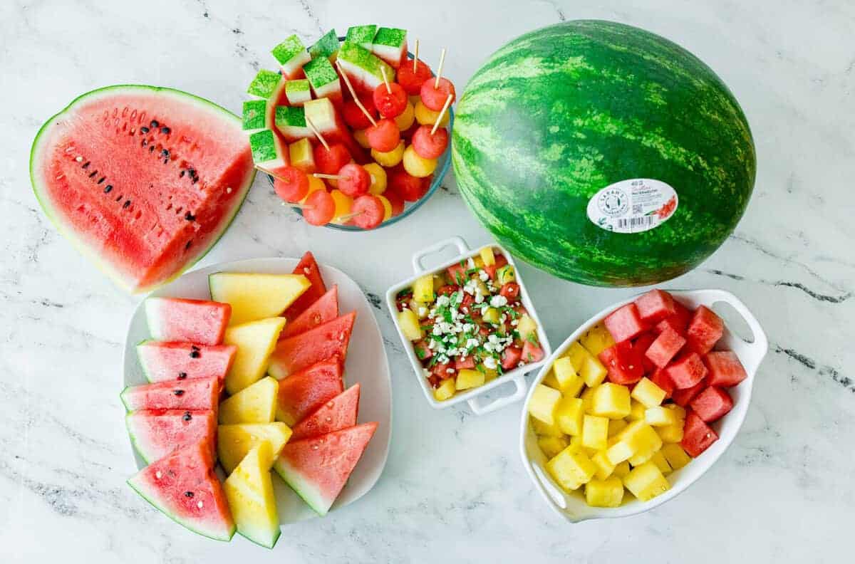 A colorful summer spread featuring sliced red and yellow watermelon, highlighting the versatility, flavor, and seasonal appeal of sustainably grown watermelon.
