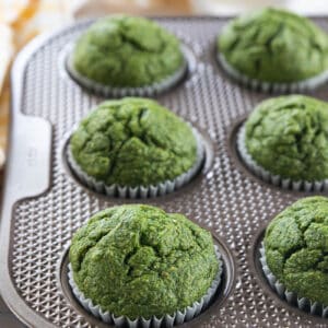 Close up of green spinach muffins in muffins tin.